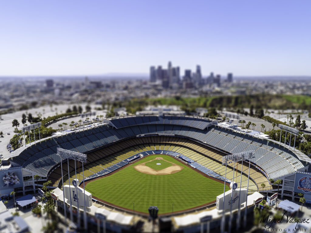 Aerial view of Dodger Stadium with the Downtown Los Angeles skyline in the background
