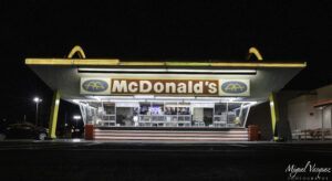 The original McDonald's neon sign lit up at night in Downey, California