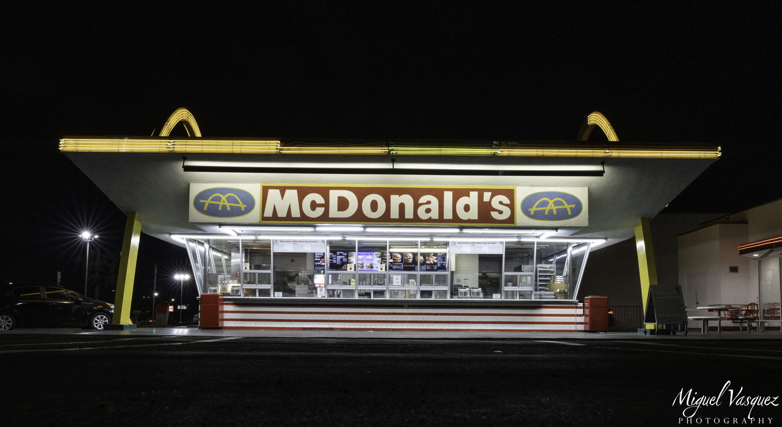 The original McDonald's neon sign lit up at night in Downey, California